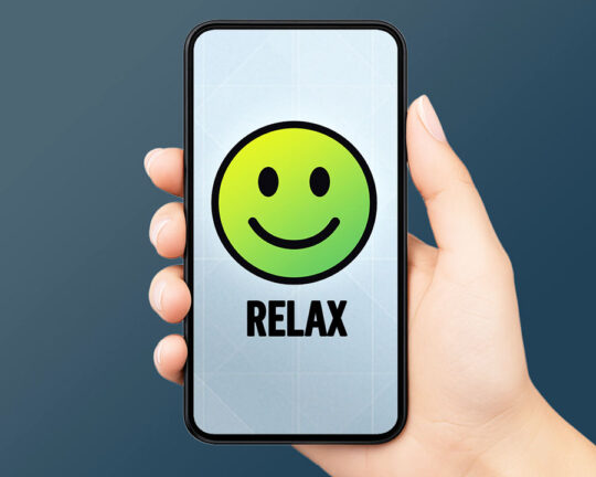 hand holding mobile phone with screenshot of completecare checking relax benefit logo