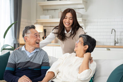happy family laughing near couch