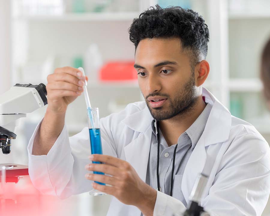 young fellow scientist working with test tube