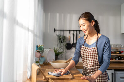 Young woman cleaning her kitchen