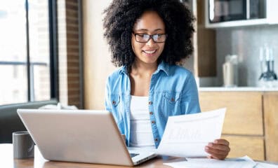 woman reviewing reports at computer